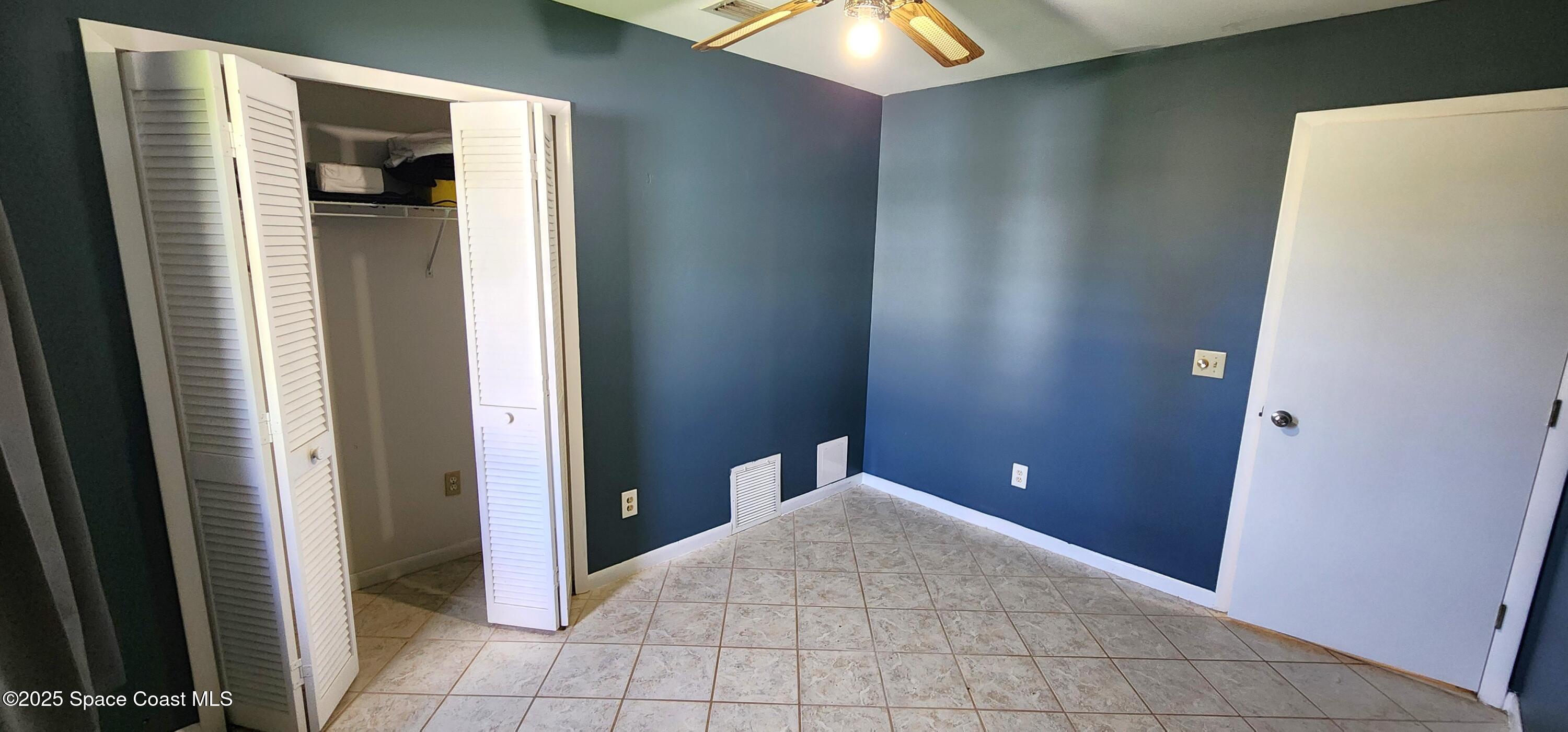7746 Mango Grove Avenue Melbourne, FL 32904 - Photo 14 of 17 a view of empty room