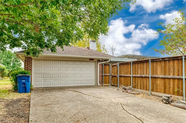 a front view of a house with a garage