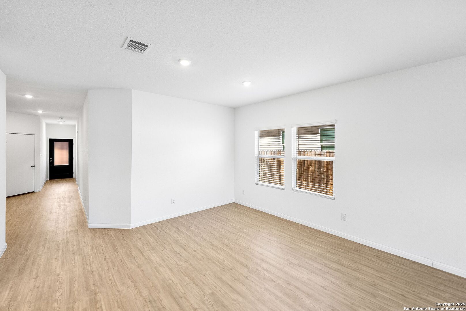 31920 Native Sun Road Bulverde, TX 78163 - Photo 12 of 62 a view of a big room with wooden floor and windows