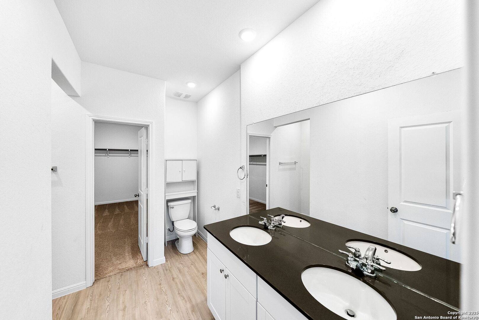 31920 Native Sun Road Bulverde, TX 78163 - Photo 17 of 62 a bathroom with a granite countertop sink and a mirror