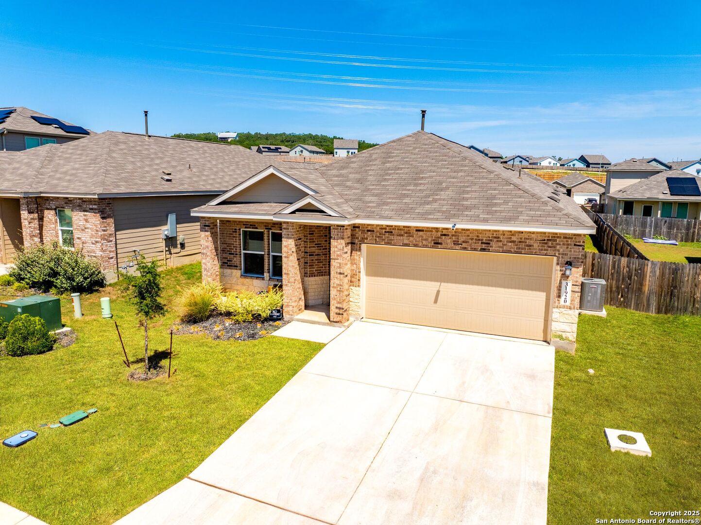 31920 Native Sun Road Bulverde, TX 78163 - Photo 2 of 62 a front view of a house with swimming pool