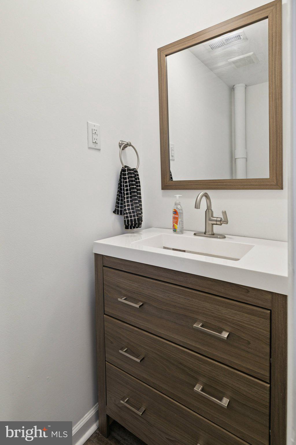 359 Lemonte Street Philadelphia, PA 19128 - Photo 11 of 37 a bathroom with a sink and a mirror
