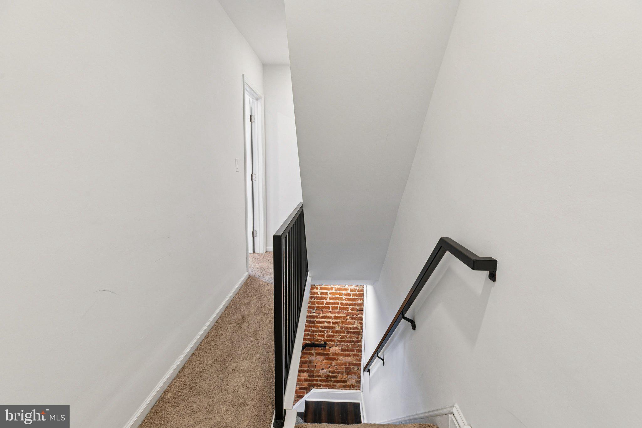 359 Lemonte Street Philadelphia, PA 19128 - Photo 12 of 37 a view of staircase with wooden floor and white walls