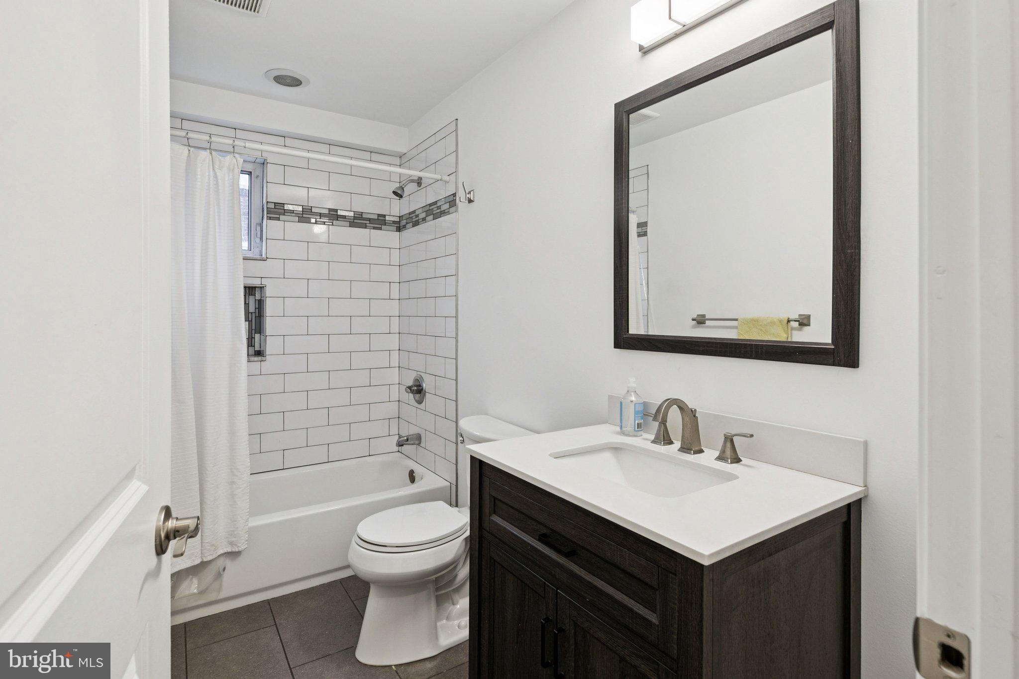 359 Lemonte Street Philadelphia, PA 19128 - Photo 16 of 37 a bathroom with a sink toilet and shower
