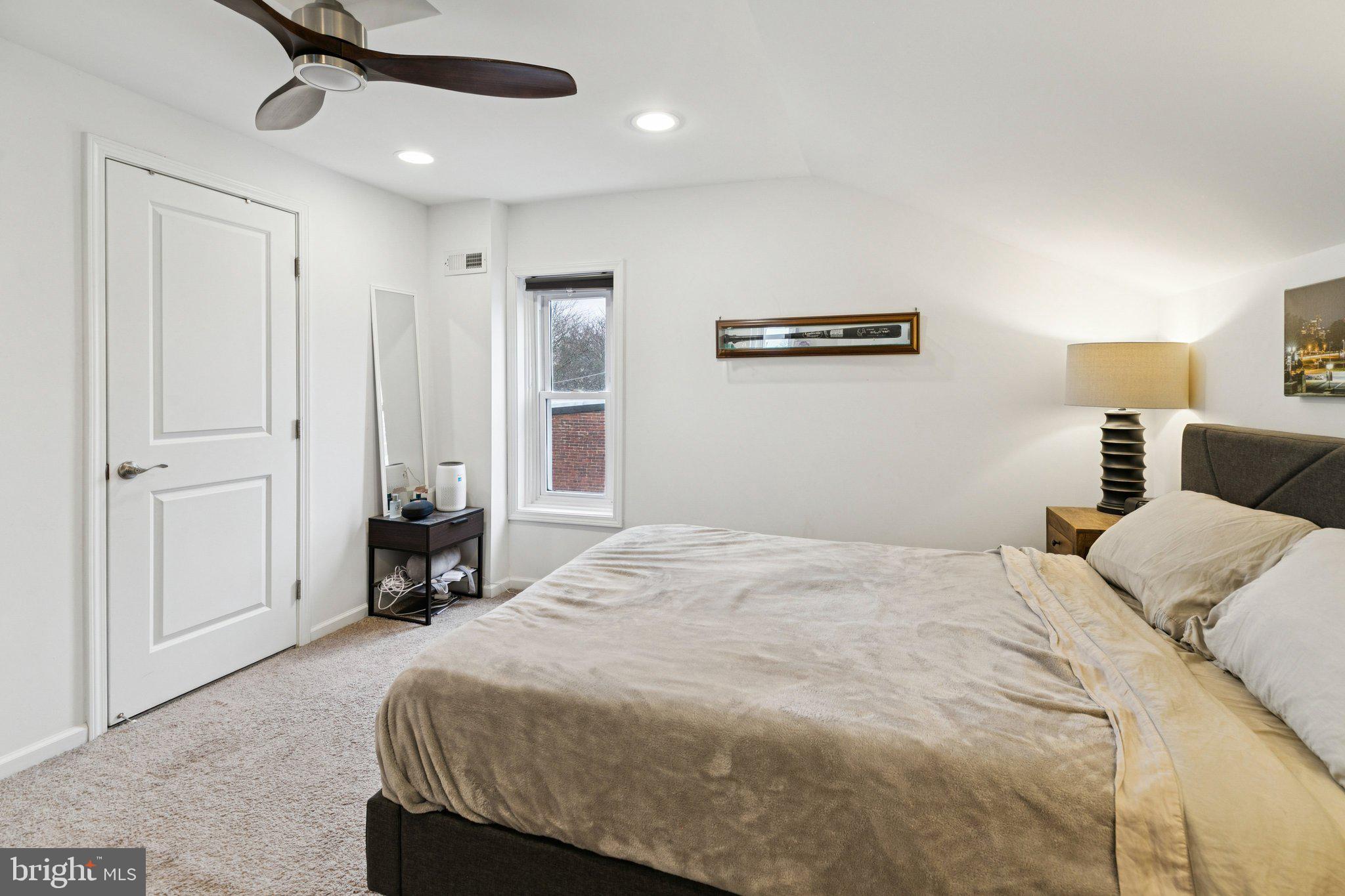 359 Lemonte Street Philadelphia, PA 19128 - Photo 23 of 37 a bed room with a bed and a ceiling fan