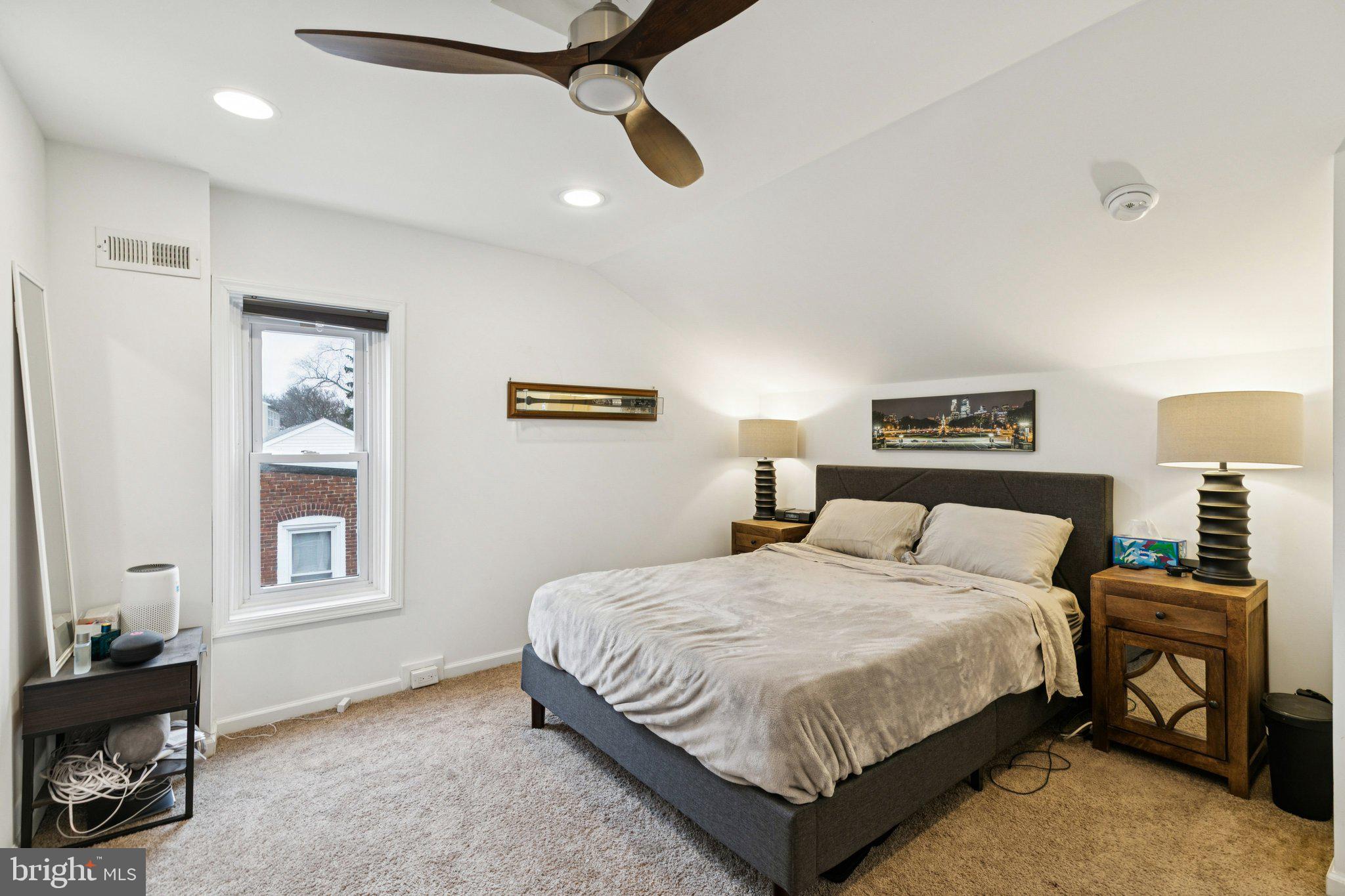 359 Lemonte Street Philadelphia, PA 19128 - Photo 24 of 37 a bedroom with a bed a dresser and painting on the wall
