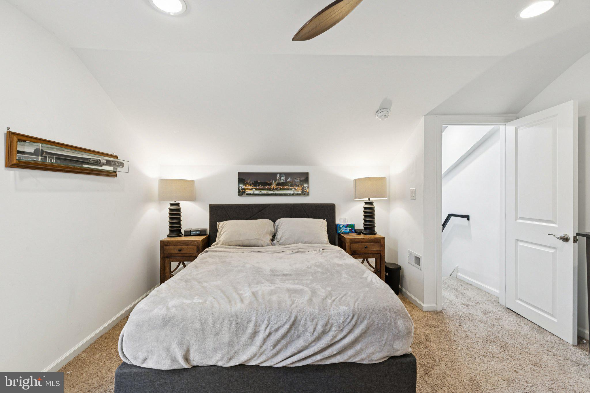 359 Lemonte Street Philadelphia, PA 19128 - Photo 27 of 37 a bedroom with a bed and wooden floor