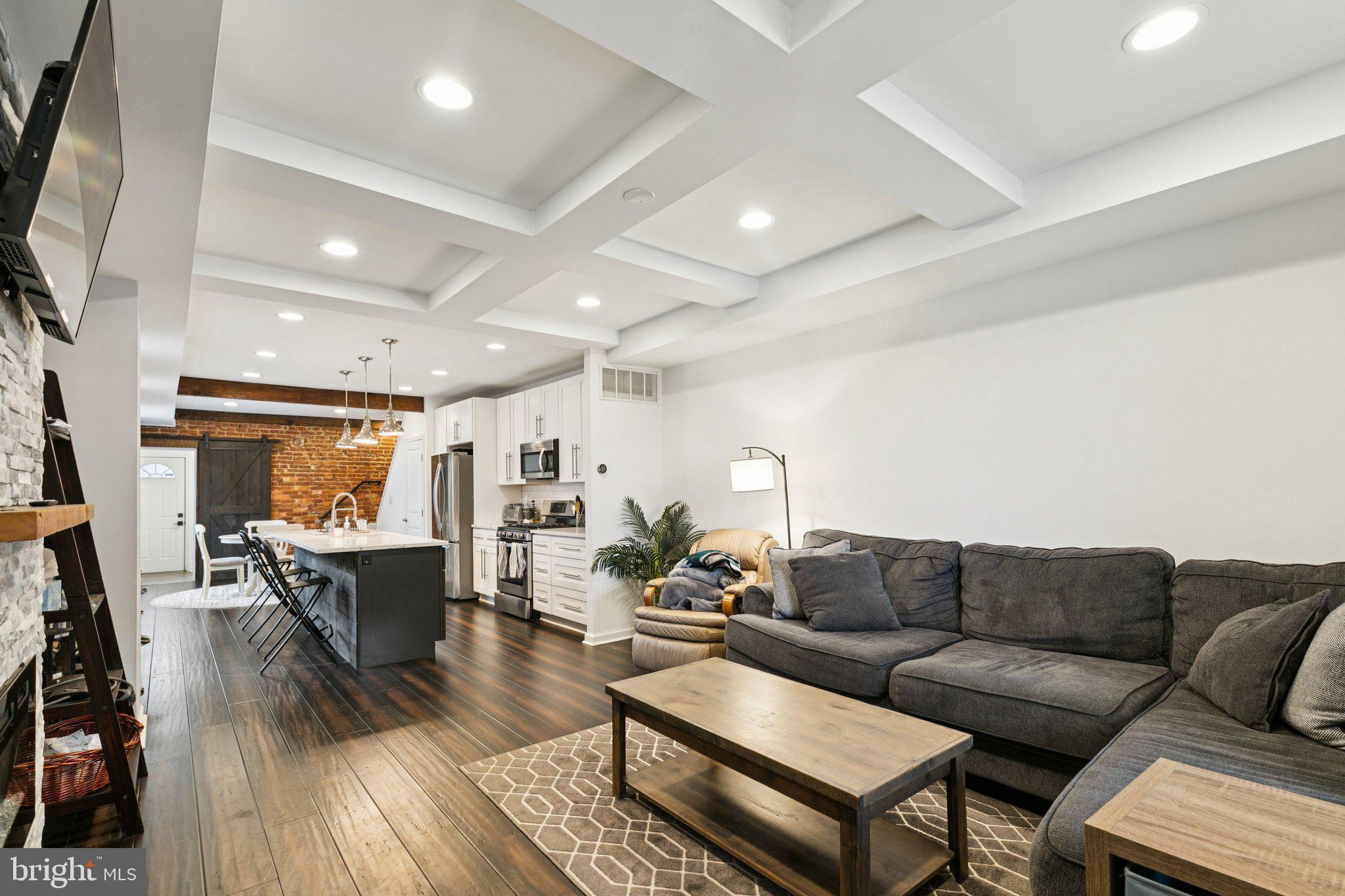 359 Lemonte Street Philadelphia, PA 19128 - Photo 3 of 37 a living room with furniture wooden floor and a flat screen tv
