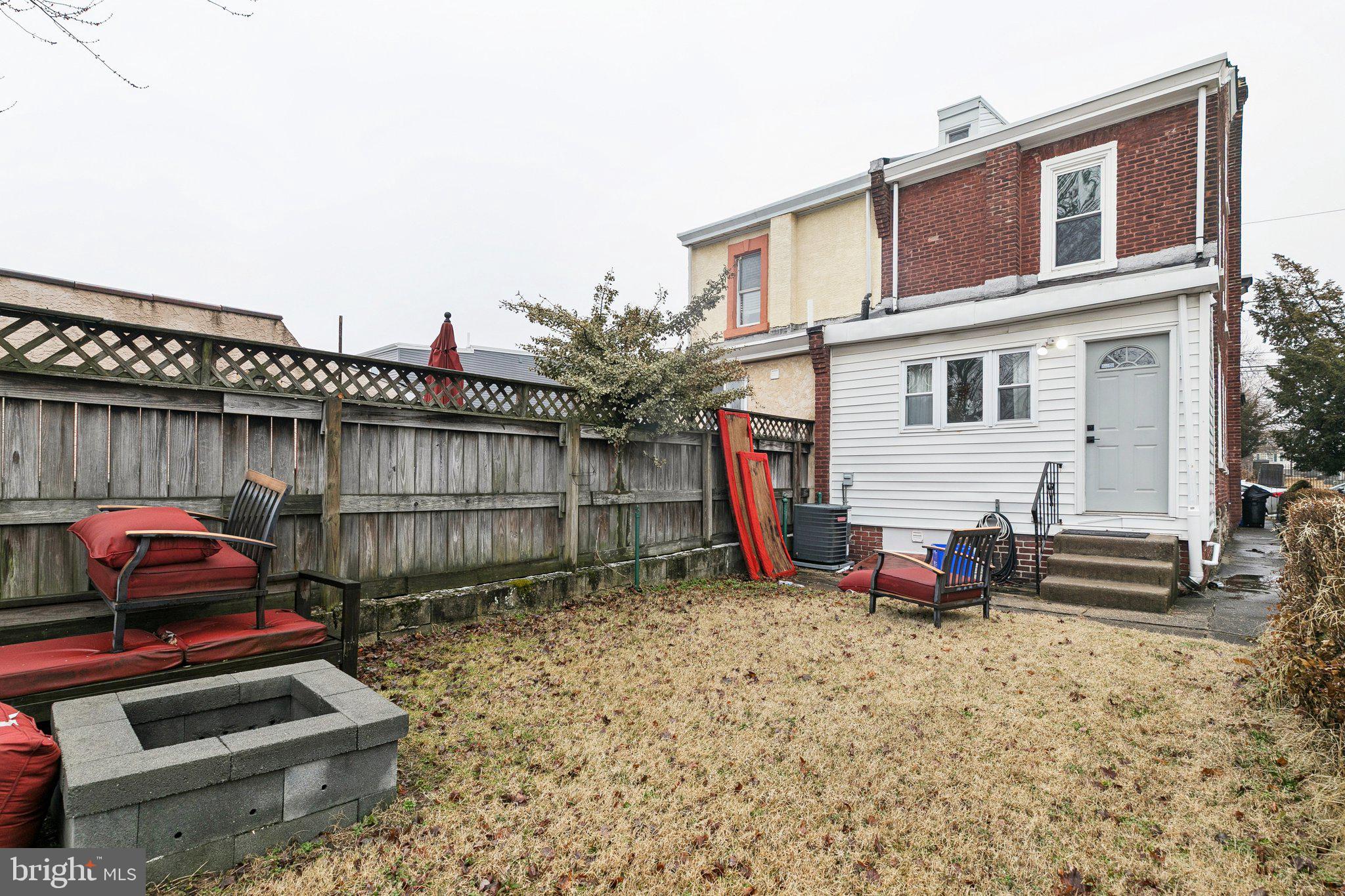 359 Lemonte Street Philadelphia, PA 19128 - Photo 37 of 37 a view of a backyard with sitting area and furniture