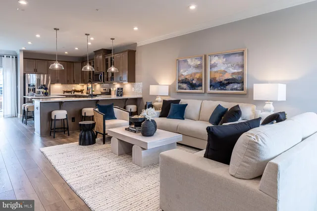 a living room with furniture and a large mirror