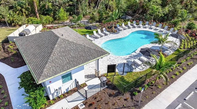 a view of a swimming pool with a patio