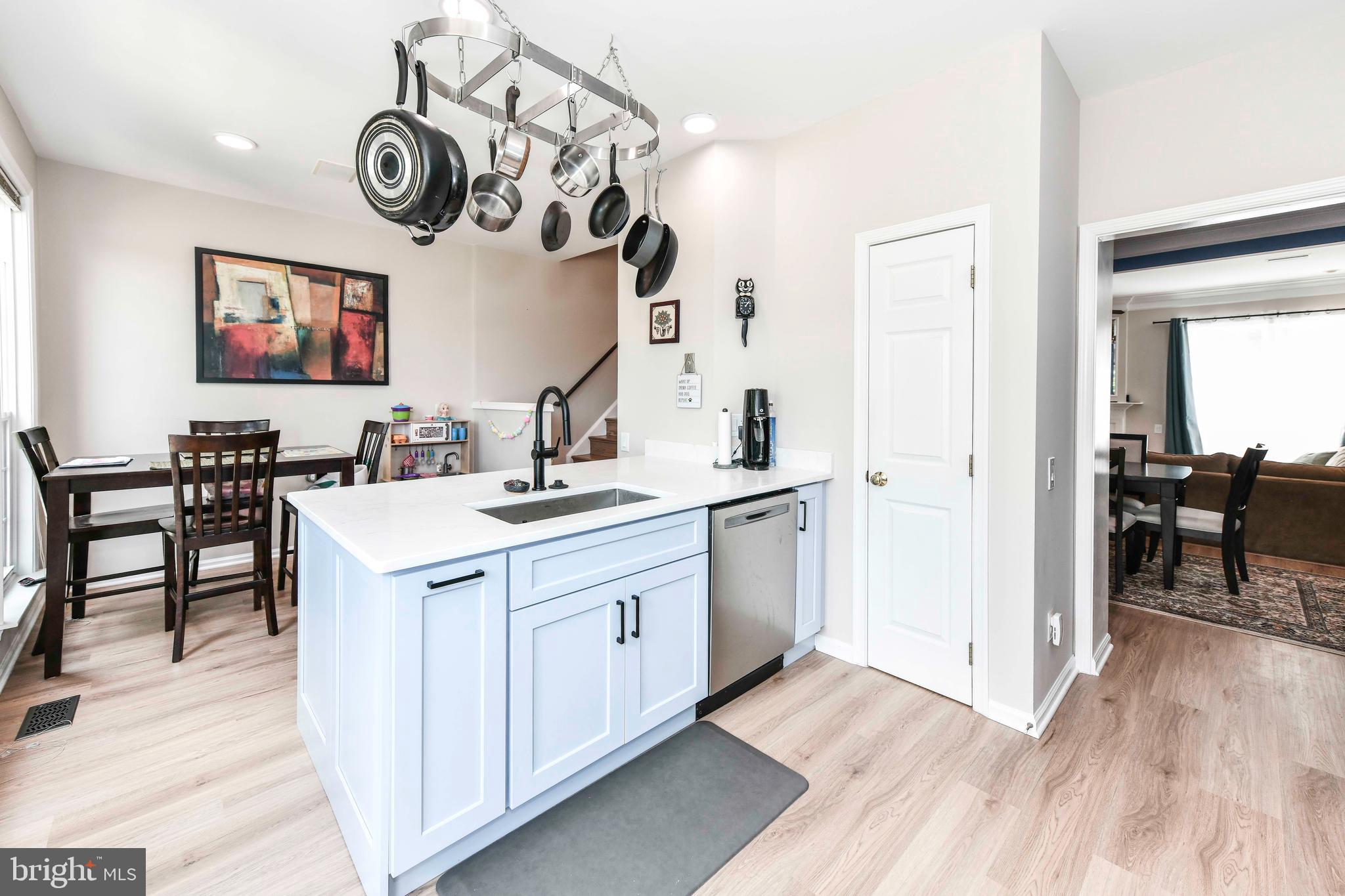 45692 Waterloo Station Square Sterling, VA 20166 - Photo 15 of 31 a kitchen with a sink and a stove top oven