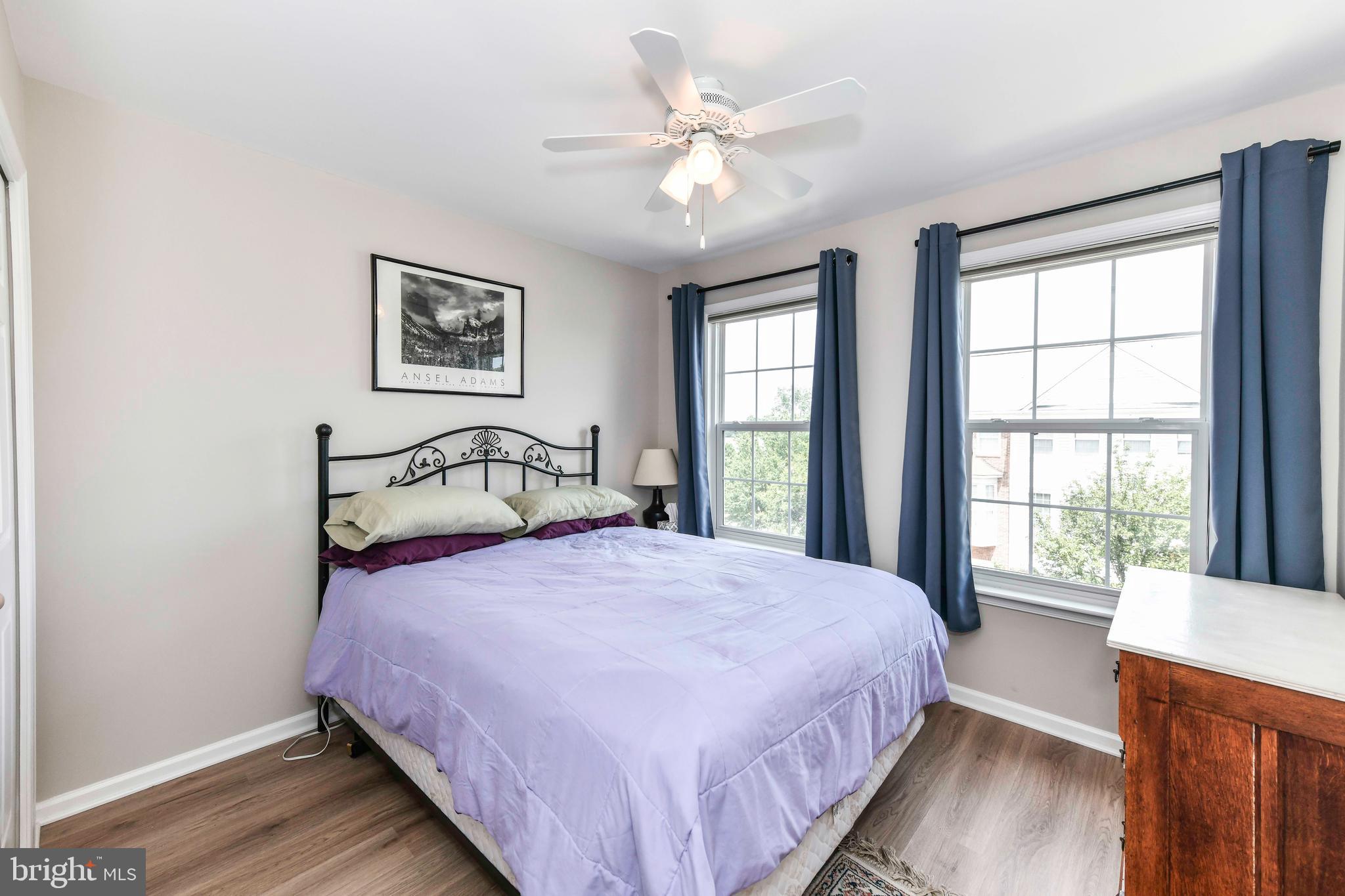 45692 Waterloo Station Square Sterling, VA 20166 - Photo 22 of 31 a bedroom with a large bed and a window