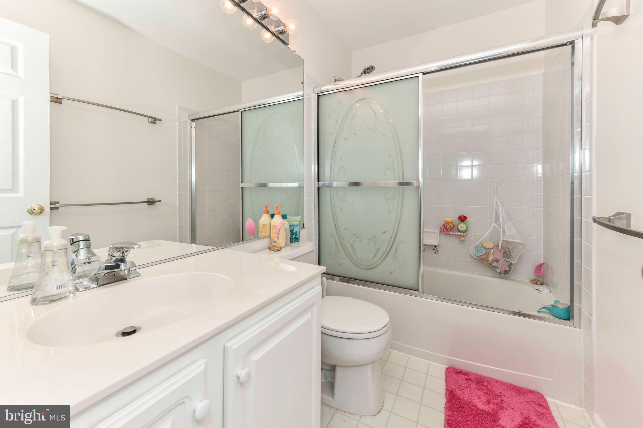 45692 Waterloo Station Square Sterling, VA 20166 - Photo 23 of 31 a bathroom with a sink toilet and shower