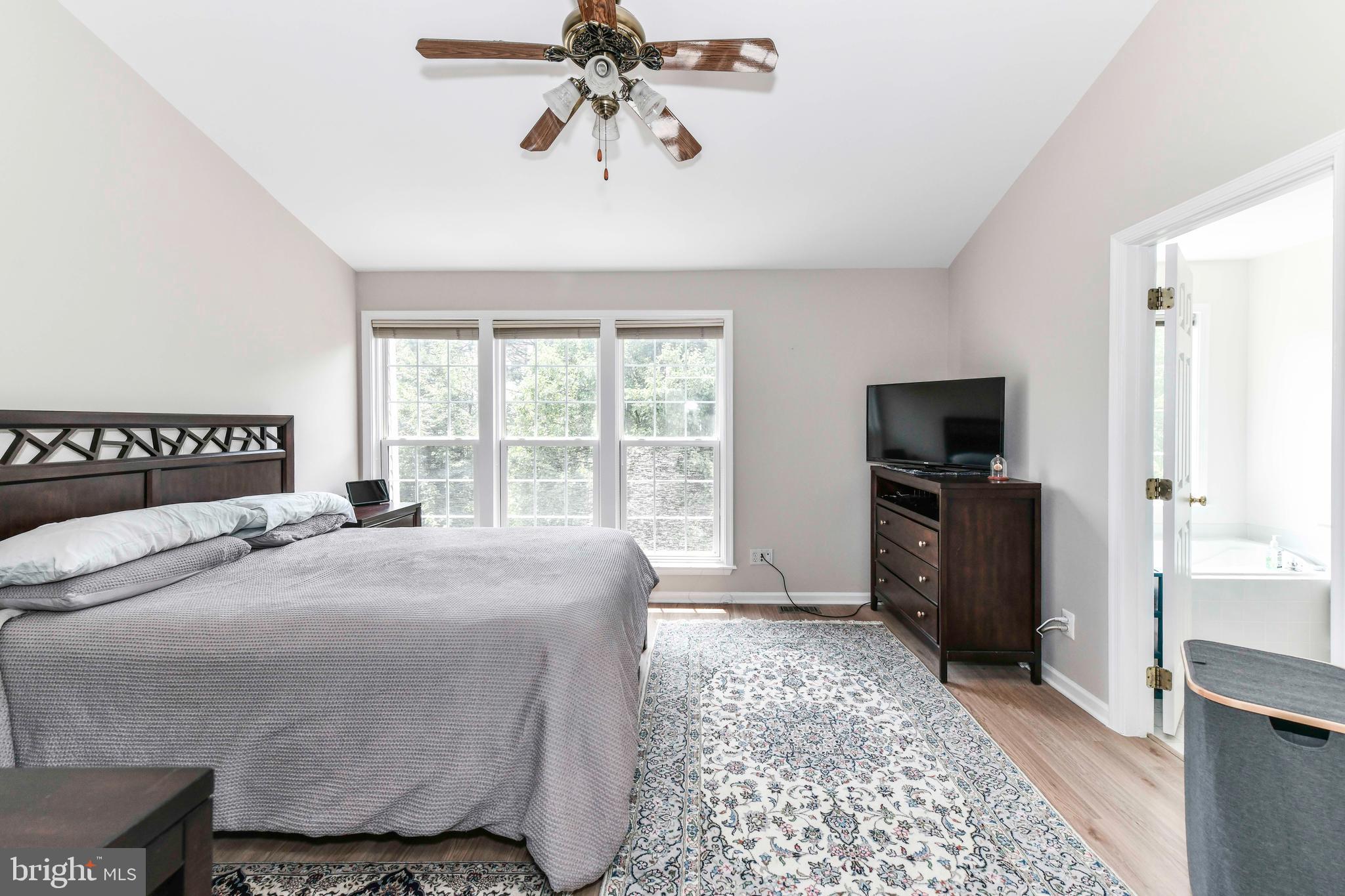 45692 Waterloo Station Square Sterling, VA 20166 - Photo 24 of 31 a bedroom with a bed and a tv on the dresser