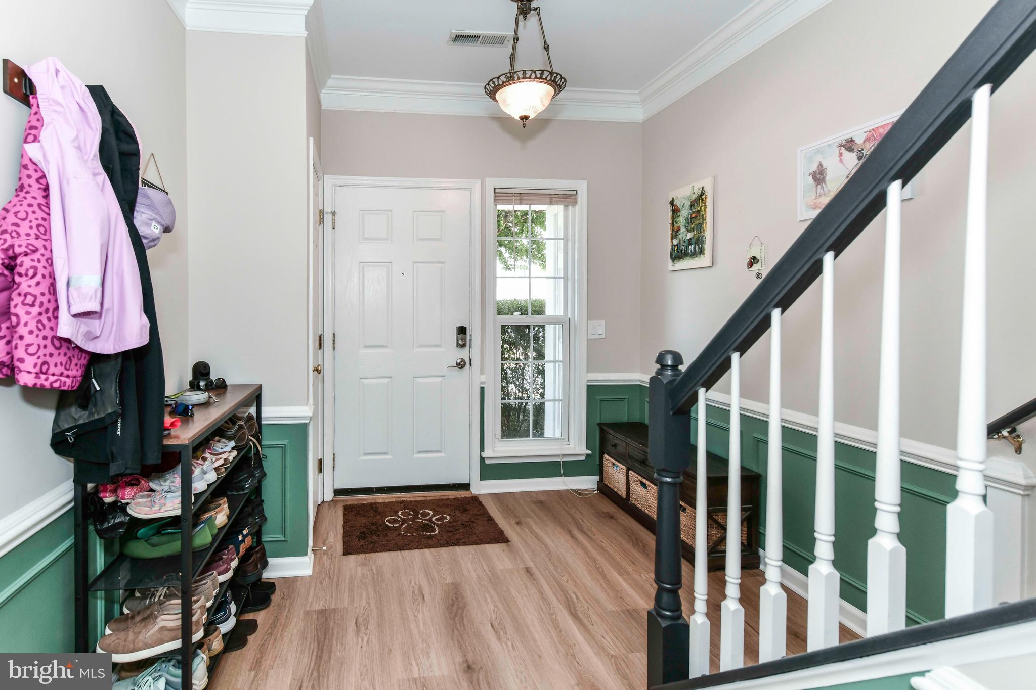 45692 Waterloo Station Square Sterling, VA 20166 - Photo 7 of 31 a view of entryway with wooden floor and stairs