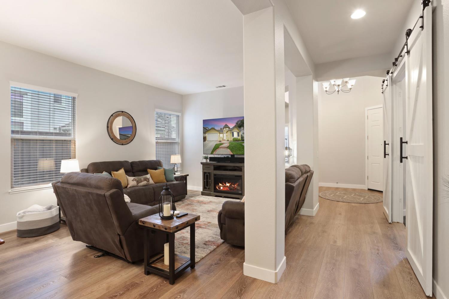 2307 Lighthouse Circle Tracy, CA 95304 - Photo 15 of 57 a living room with furniture and a flat screen tv