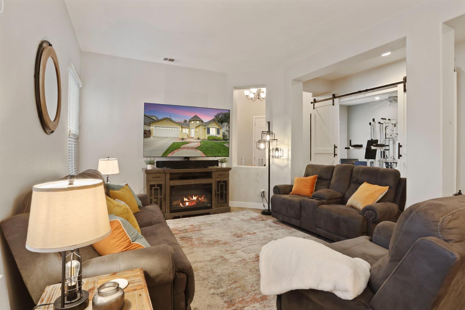 2307 Lighthouse Circle Tracy, CA 95304 - Photo 17 of 57 a living room with furniture and a flat screen tv