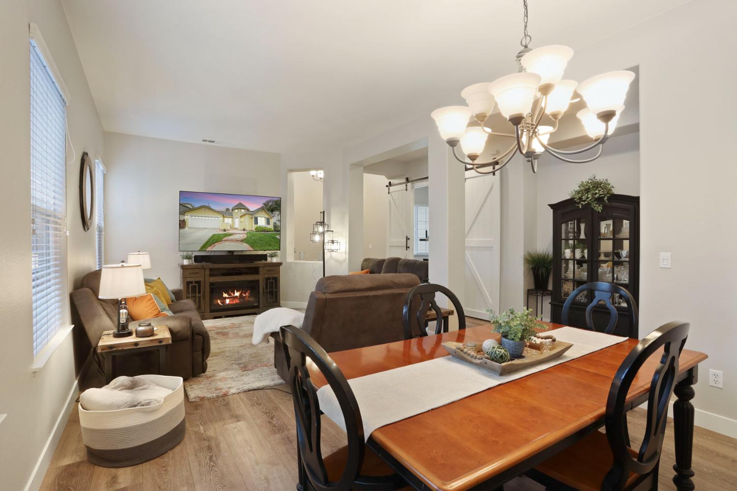2307 Lighthouse Circle Tracy, CA 95304 - Photo 19 of 57 a dining room with furniture a chandelier and window