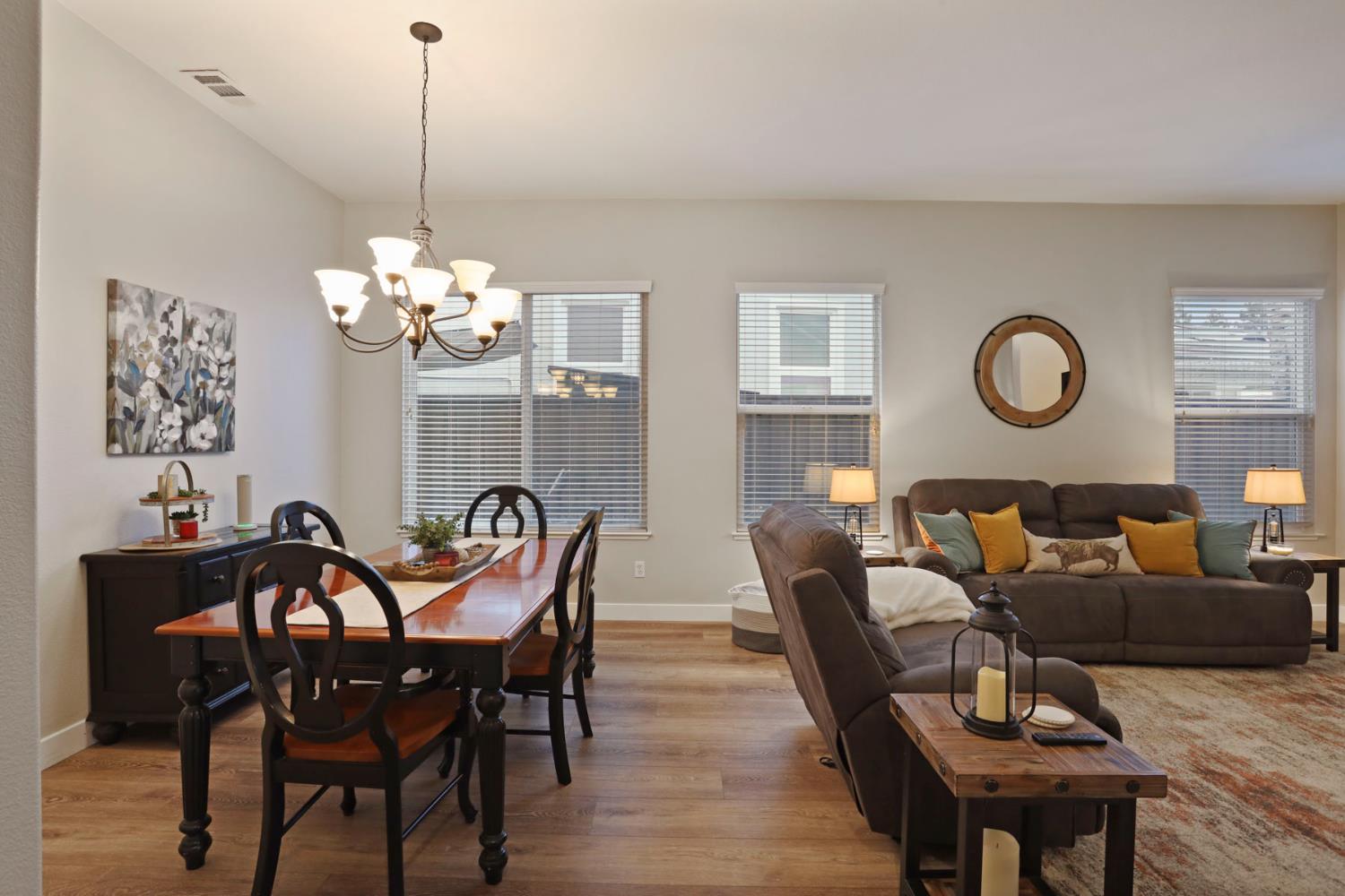 2307 Lighthouse Circle Tracy, CA 95304 - Photo 20 of 57 a view of a dining room with furniture and chandelier