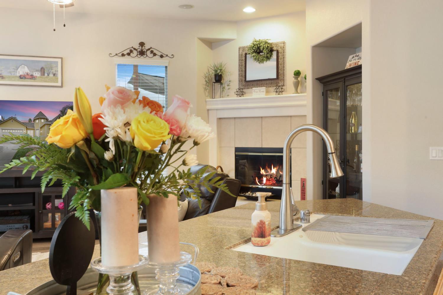 2307 Lighthouse Circle Tracy, CA 95304 - Photo 31 of 57 a living room with furniture and a fireplace
