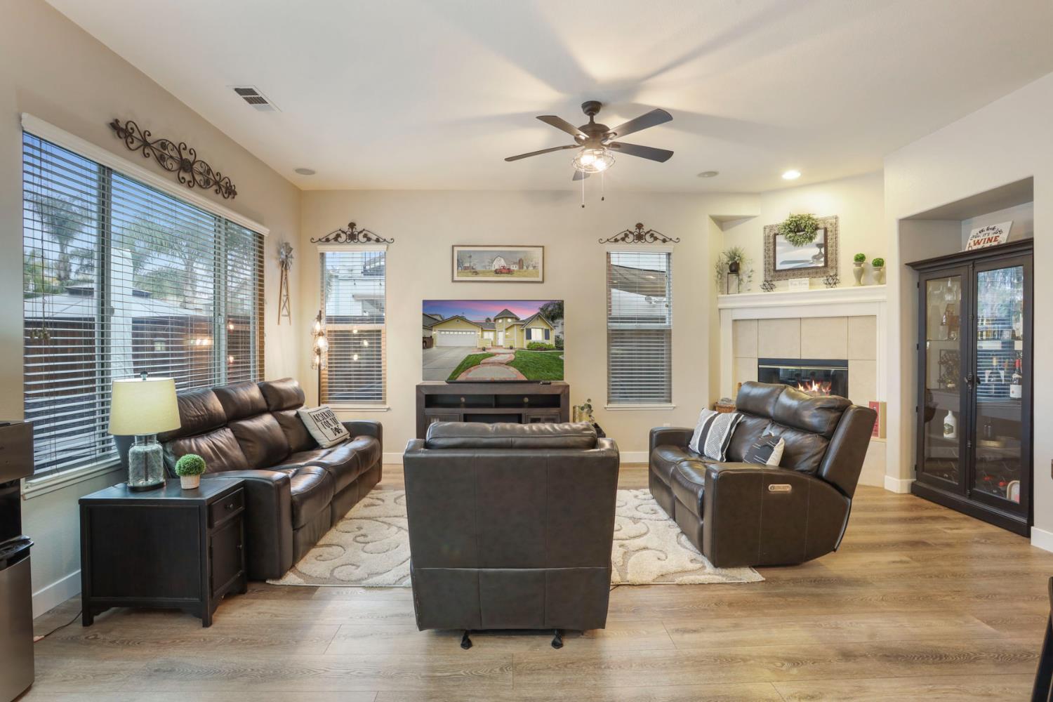 2307 Lighthouse Circle Tracy, CA 95304 - Photo 32 of 57 a living room with furniture and a flat screen tv