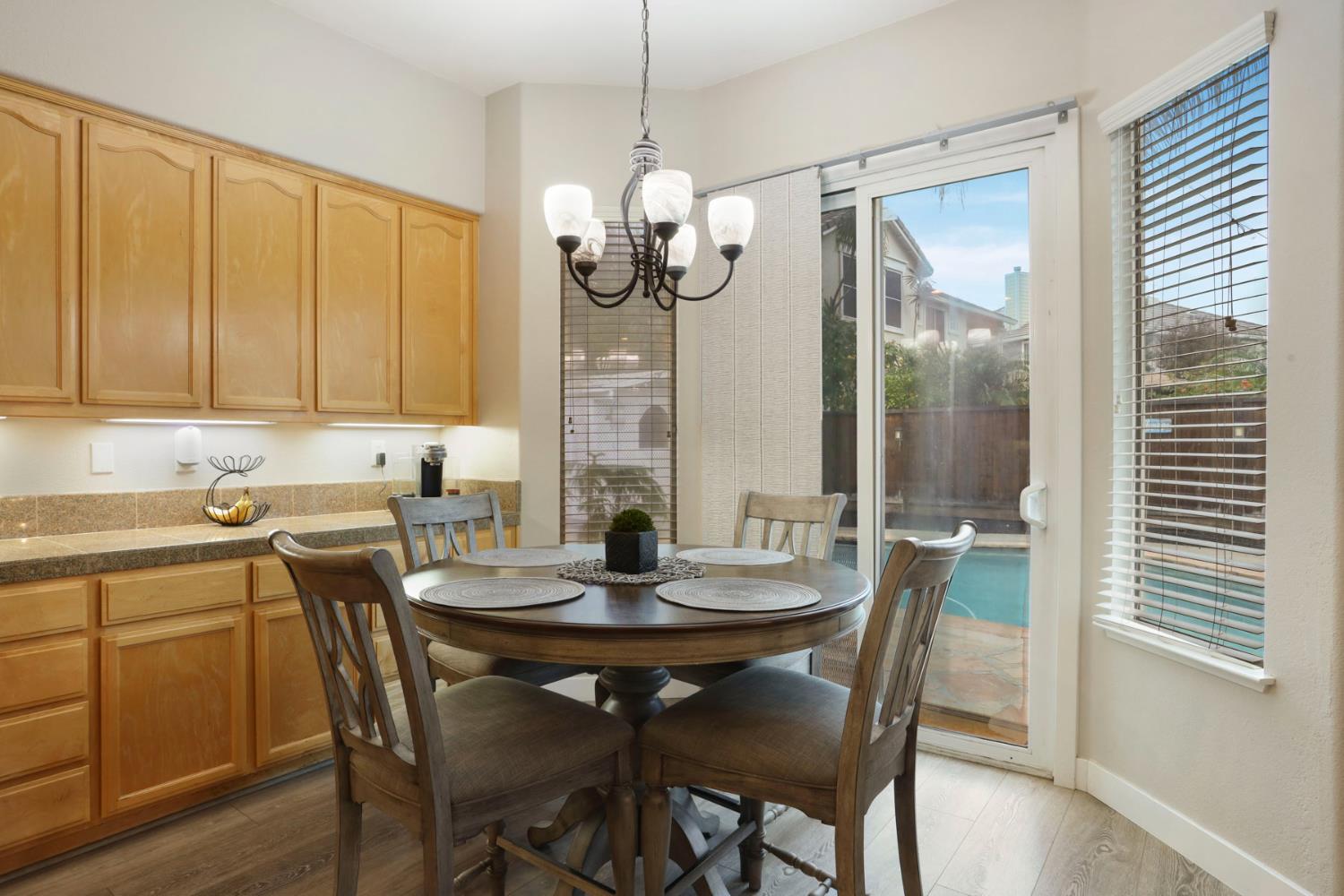 2307 Lighthouse Circle Tracy, CA 95304 - Photo 34 of 57 a view of a dining room with furniture window and wooden floor