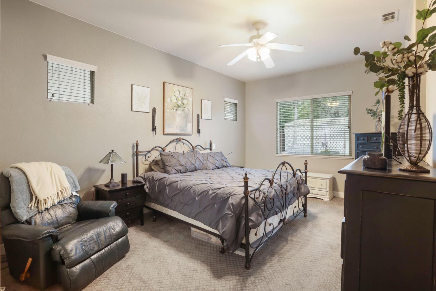 2307 Lighthouse Circle Tracy, CA 95304 - Photo 43 of 57 a spacious bedroom with a bed and a couch