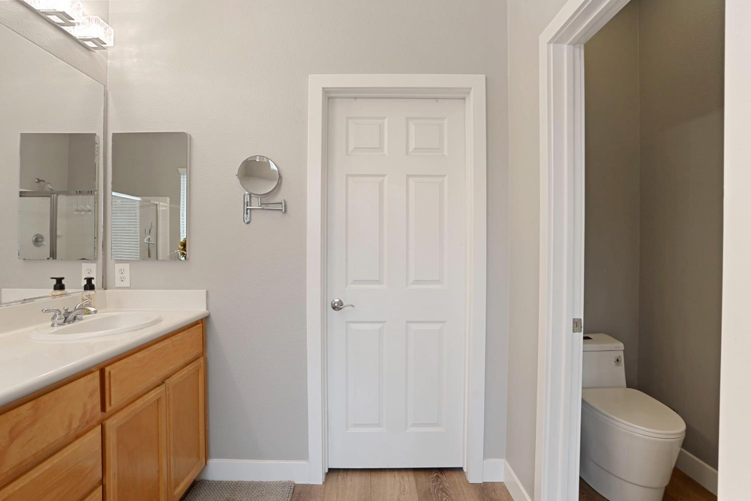 2307 Lighthouse Circle Tracy, CA 95304 - Photo 49 of 57 a bathroom with a granite countertop sink toilet and shower