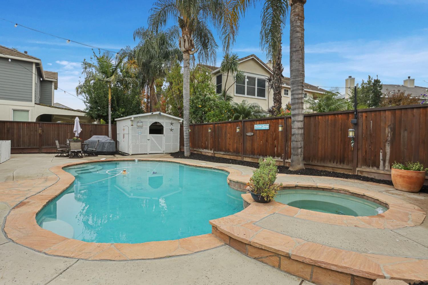 2307 Lighthouse Circle Tracy, CA 95304 - Photo 51 of 57 a backyard of a house with yard fire pit and outdoor seating