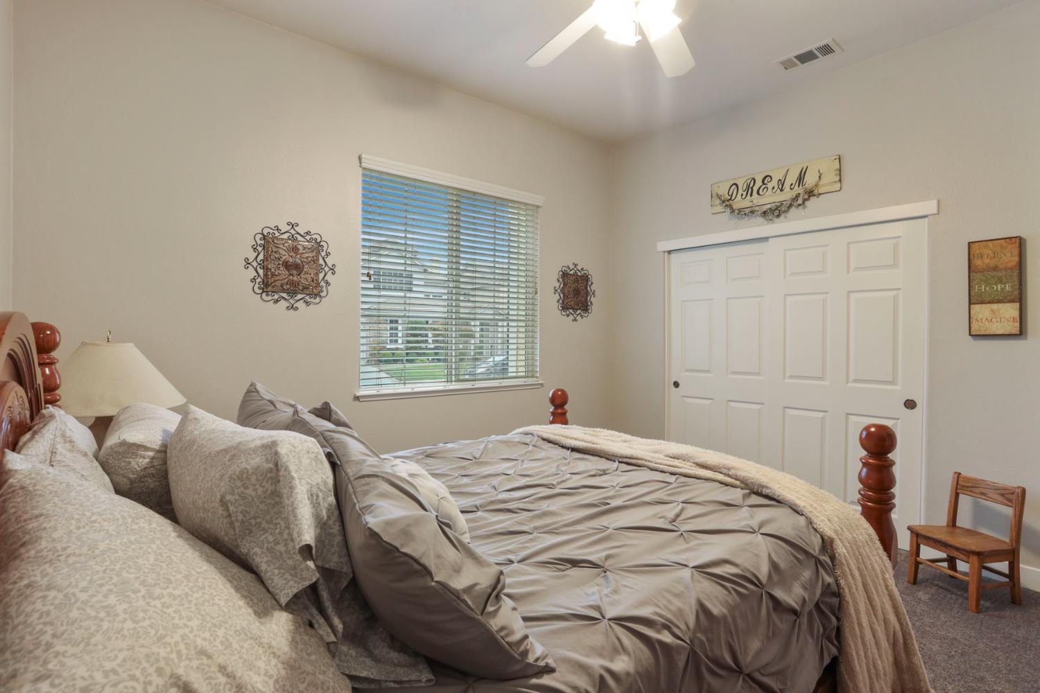 2307 Lighthouse Circle Tracy, CA 95304 - Photo 7 of 57 a bedroom with a bed and a window