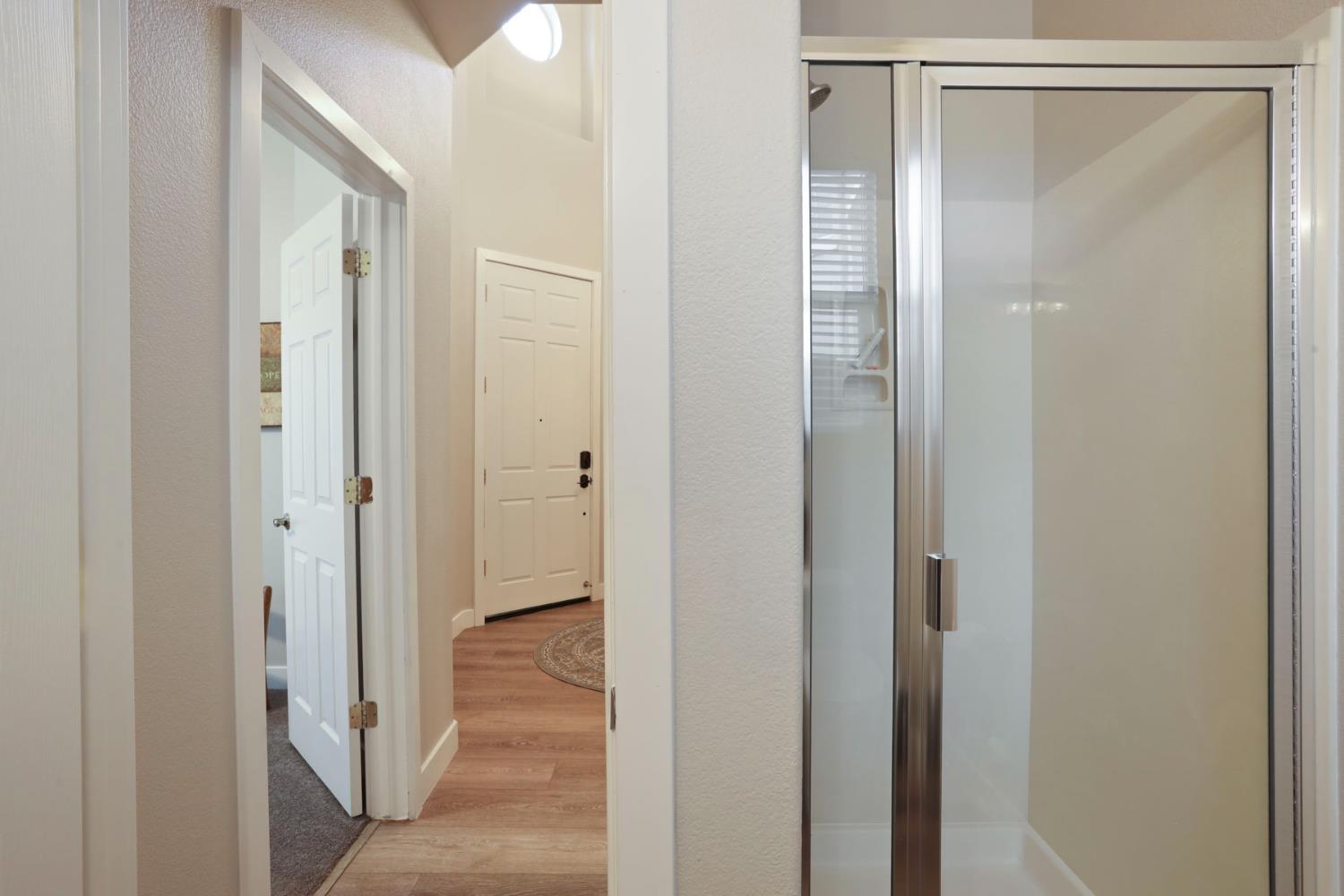 2307 Lighthouse Circle Tracy, CA 95304 - Photo 10 of 57 a view of a bathroom from a hallway