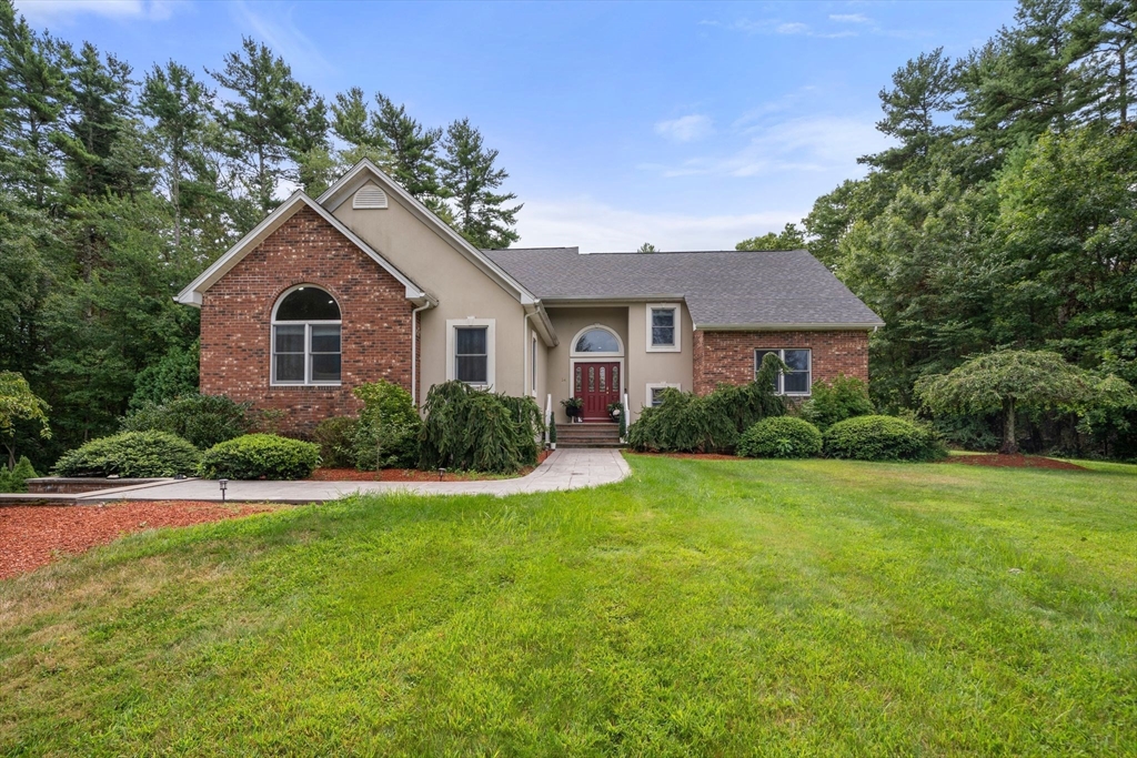 34 Wood Duck Road Acushnet, MA 02743 - Photo 1 of 23 a front view of a house with a yard and garage