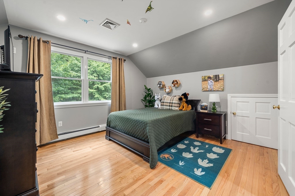 34 Wood Duck Road Acushnet, MA 02743 - Photo 12 of 23 a bedroom with a bed and a dresser next to a window