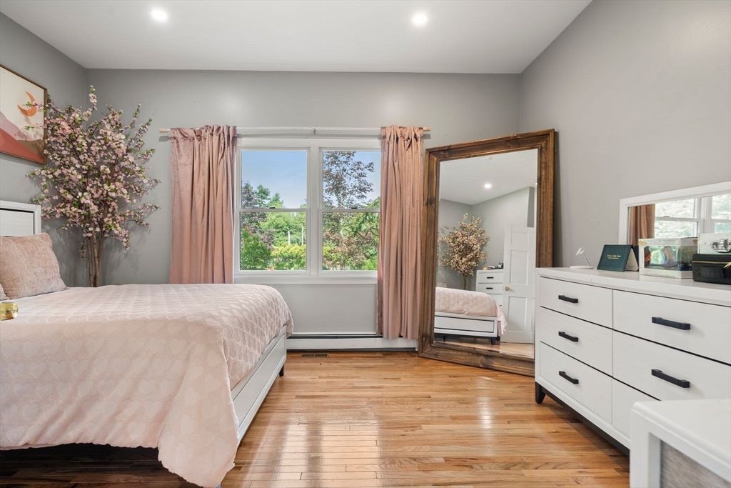 34 Wood Duck Road Acushnet, MA 02743 - Photo 13 of 23 a bedroom with a large bed and a window