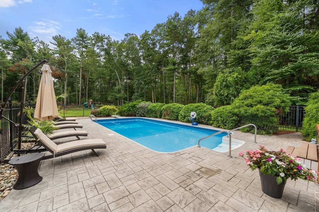 34 Wood Duck Road Acushnet, MA 02743 - Photo 19 of 23 a view of a backyard with sitting area