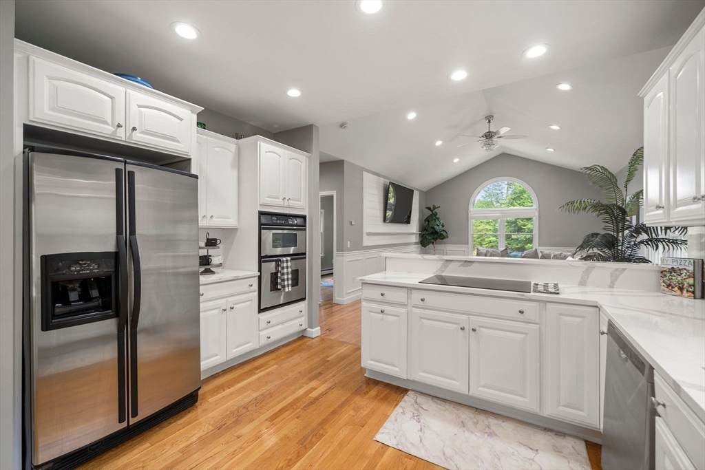 34 Wood Duck Road Acushnet, MA 02743 - Photo 5 of 23 a large kitchen with stainless steel appliances kitchen island granite countertop a refrigerator and a sink