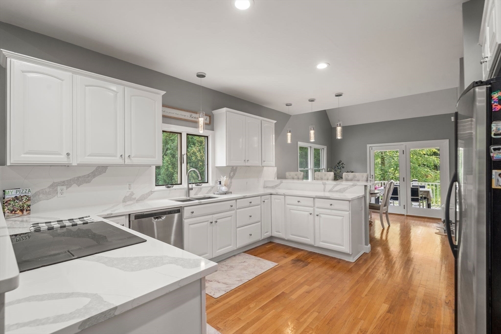 34 Wood Duck Road Acushnet, MA 02743 - Photo 6 of 23 a kitchen with a sink stove and cabinets