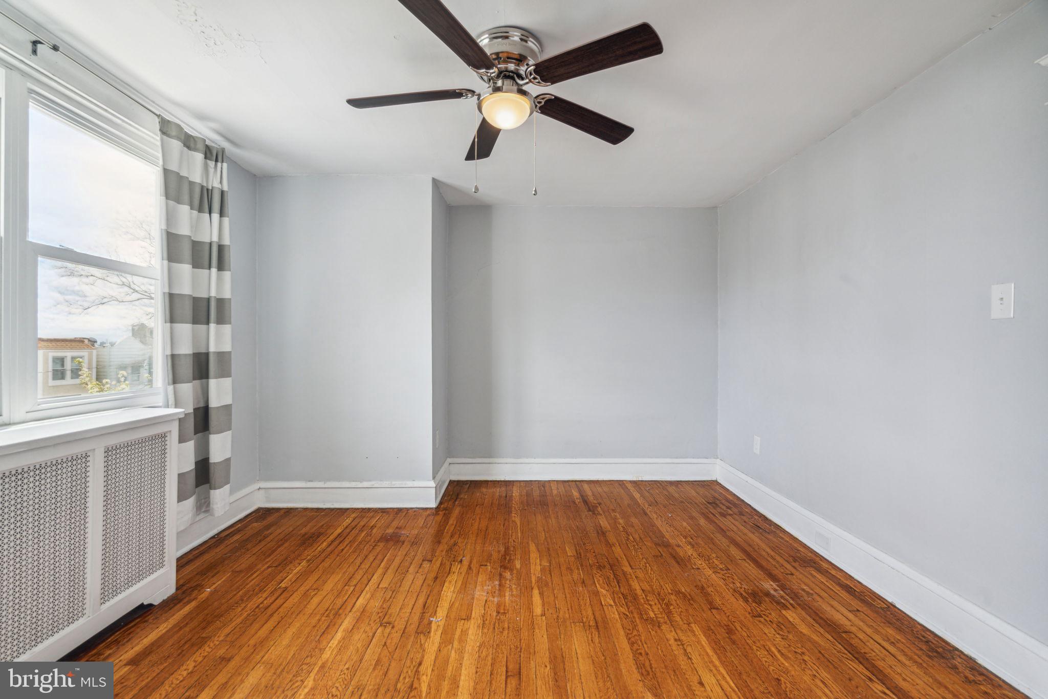 3455 Tilden Street Philadelphia, PA 19129 - Photo 16 of 32 a view of empty room with wooden floor and fan