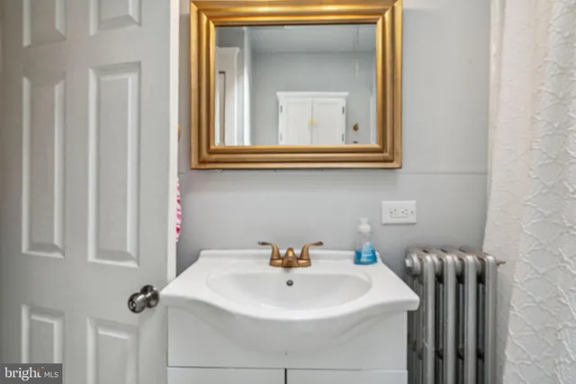 a bathroom with a sink a toilet and a bathtub