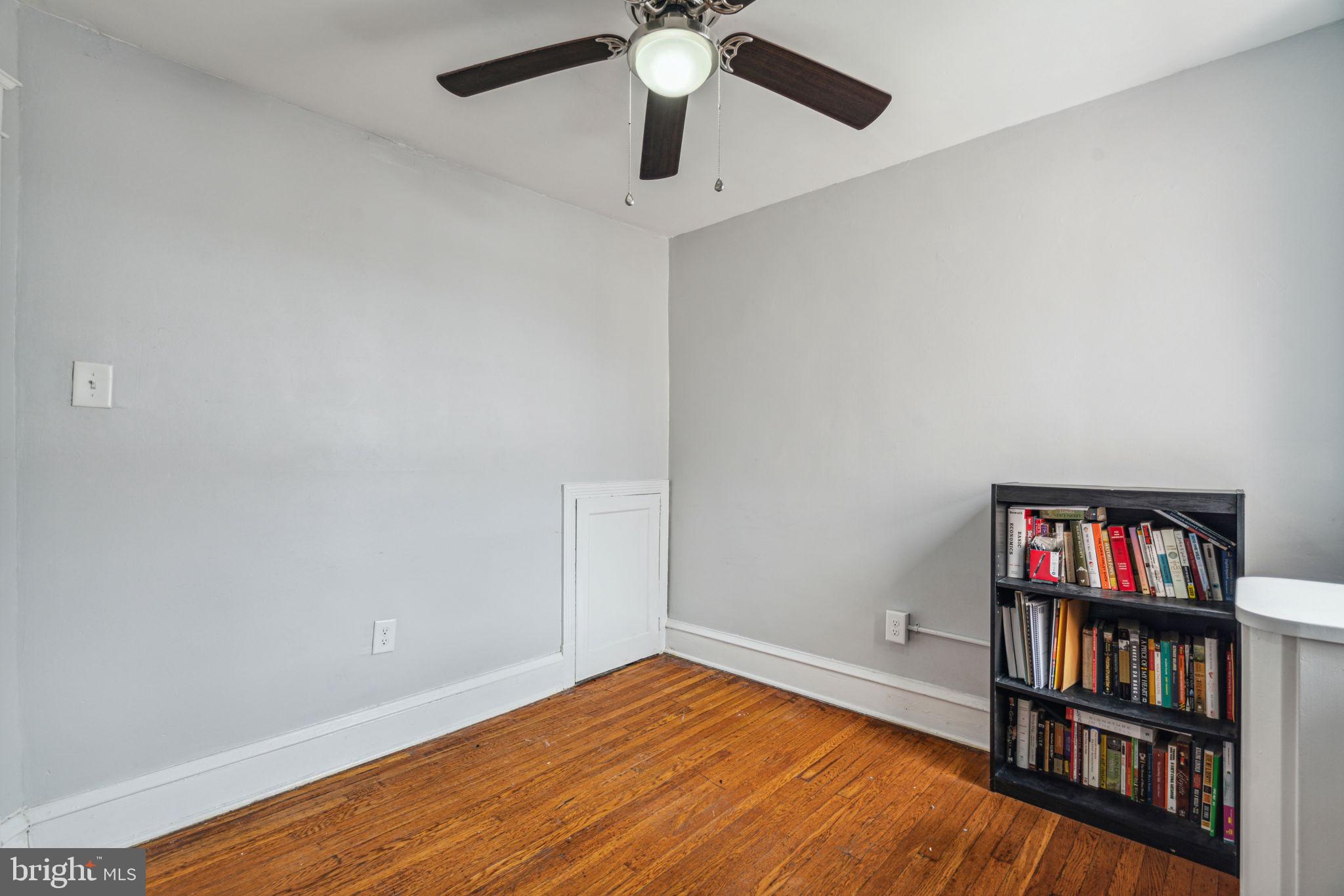 3455 Tilden Street Philadelphia, PA 19129 - Photo 26 of 32 a view of room with window and book shelf