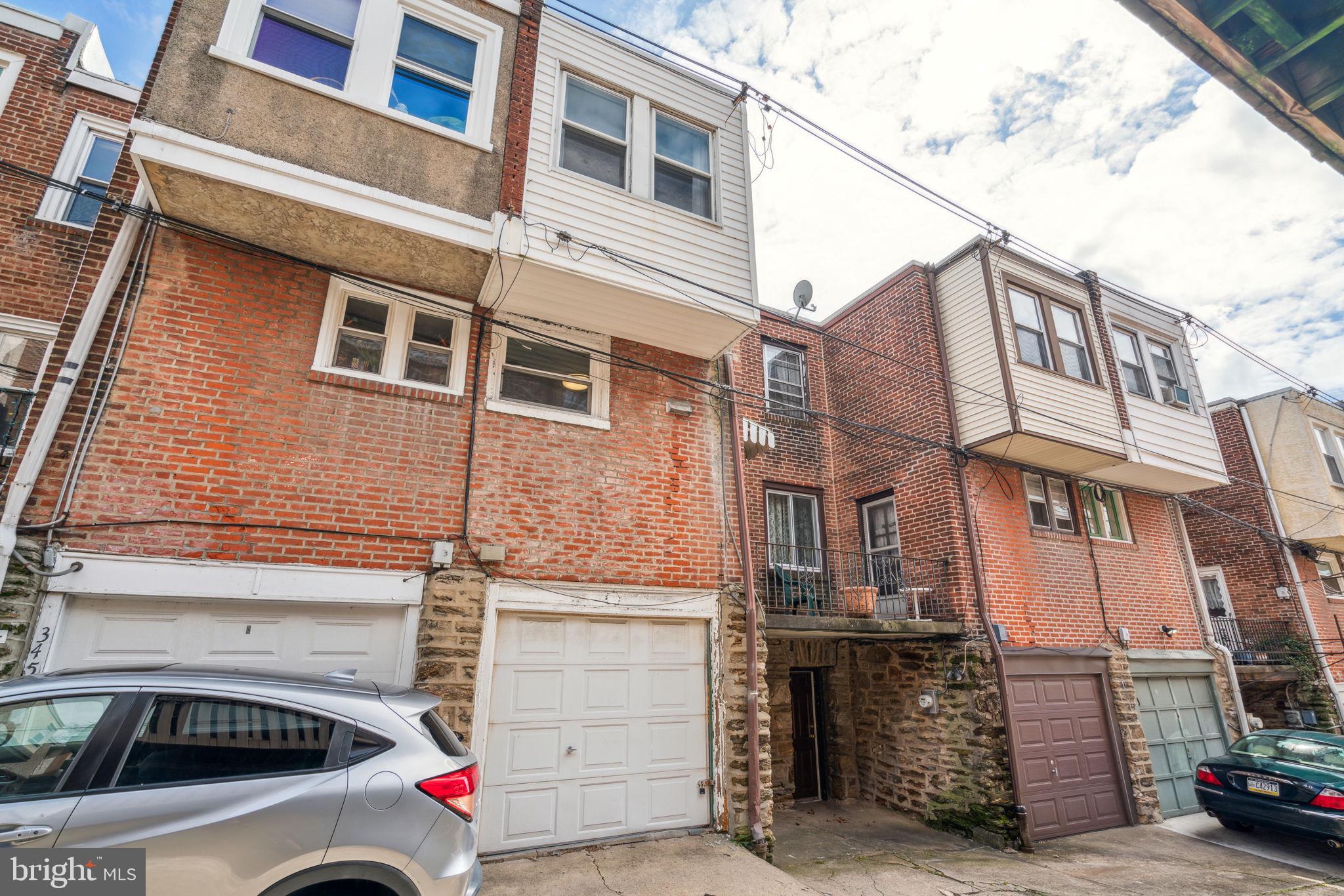 3455 Tilden Street Philadelphia, PA 19129 - Photo 31 of 32 a view of a street that has couple of cars parked on road