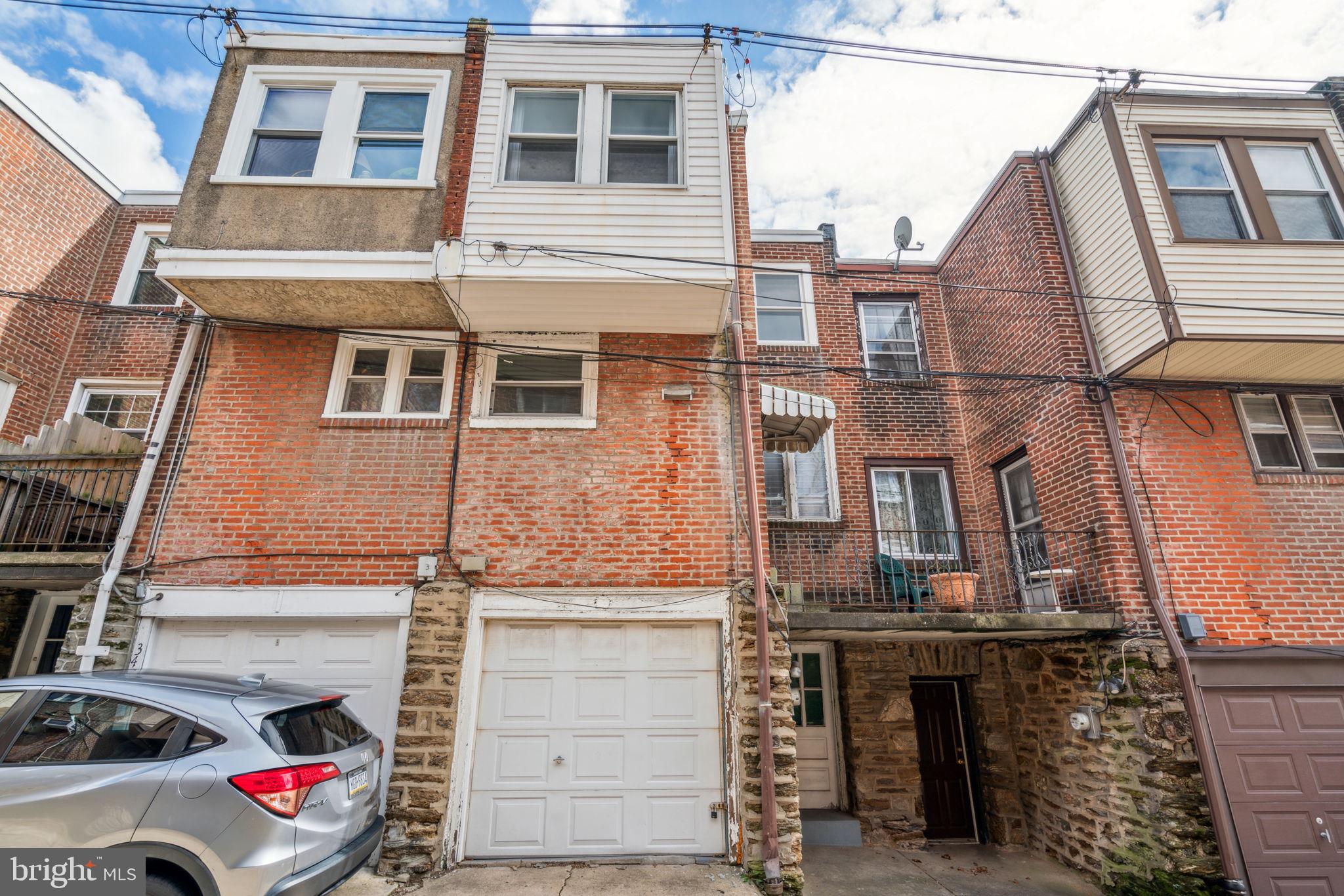 3455 Tilden Street Philadelphia, PA 19129 - Photo 32 of 32 a front view of a house with a space