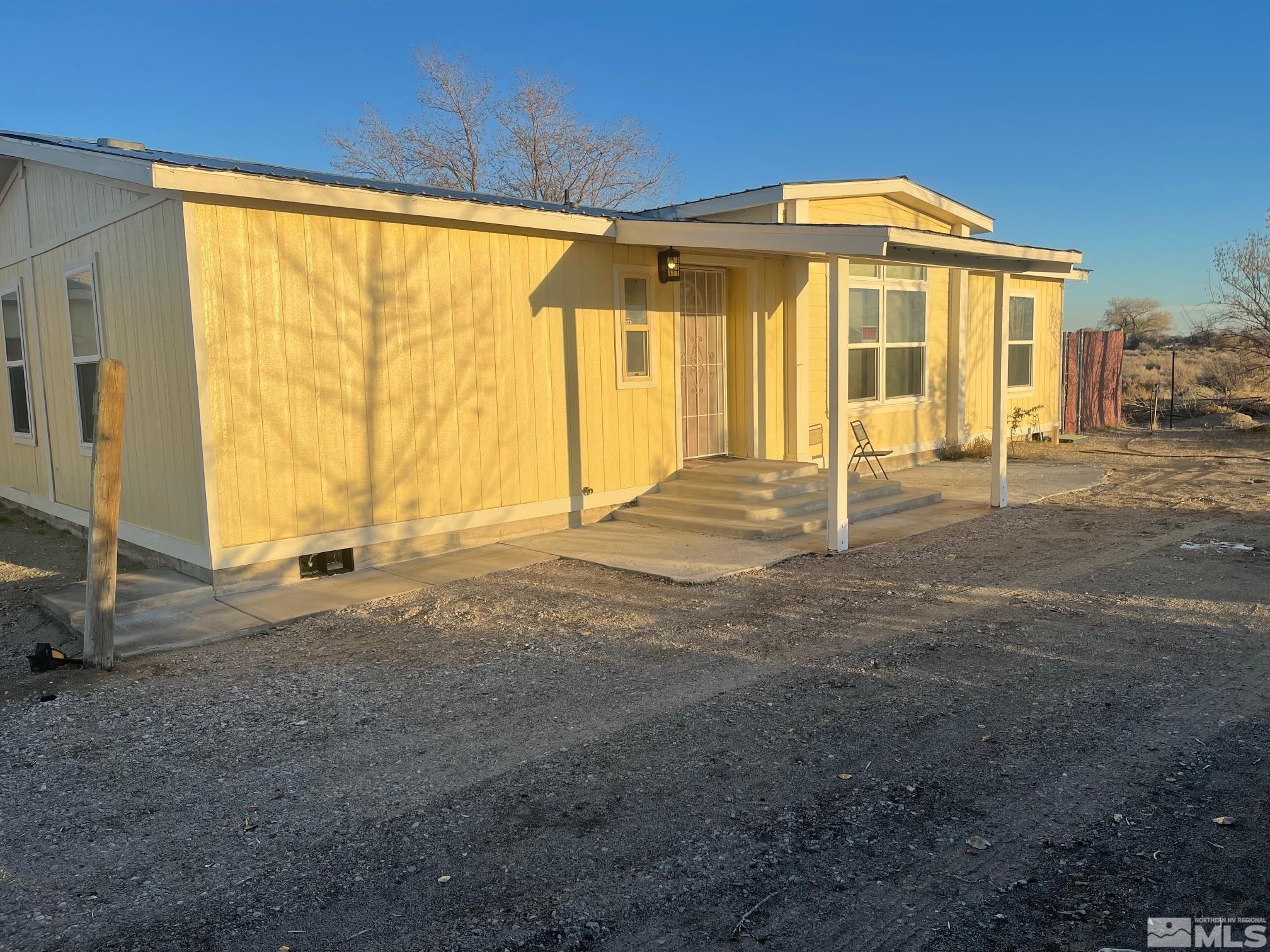 1130 Heidi Road Fallon, NV 89406 - Photo 3 of 12 a front view of a house with a yard