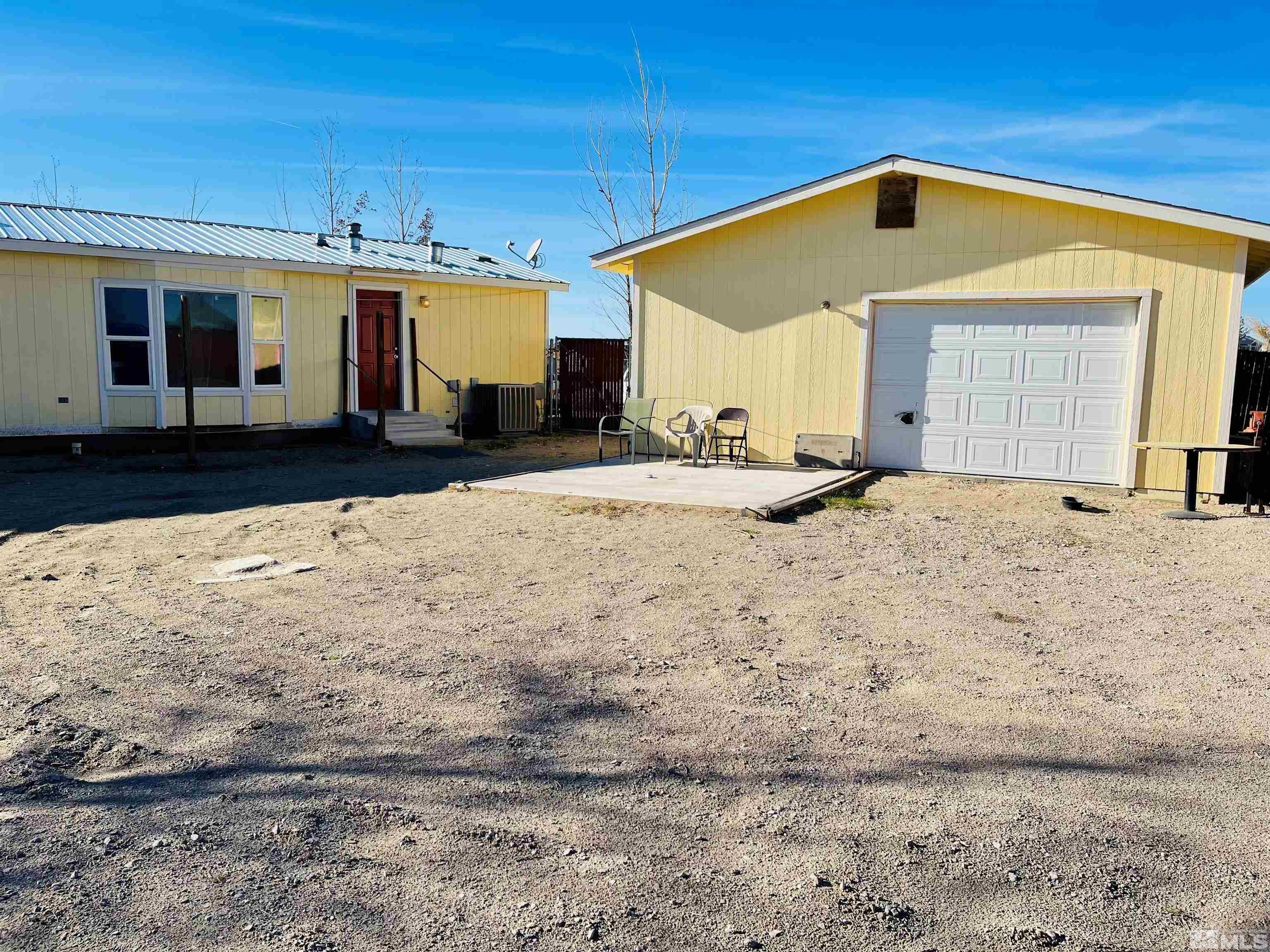 1130 Heidi Road Fallon, NV 89406 - Photo 4 of 12 a front view of a house with a yard