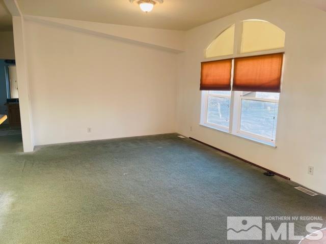 1130 Heidi Road Fallon, NV 89406 - Photo 6 of 12 an empty room with a window