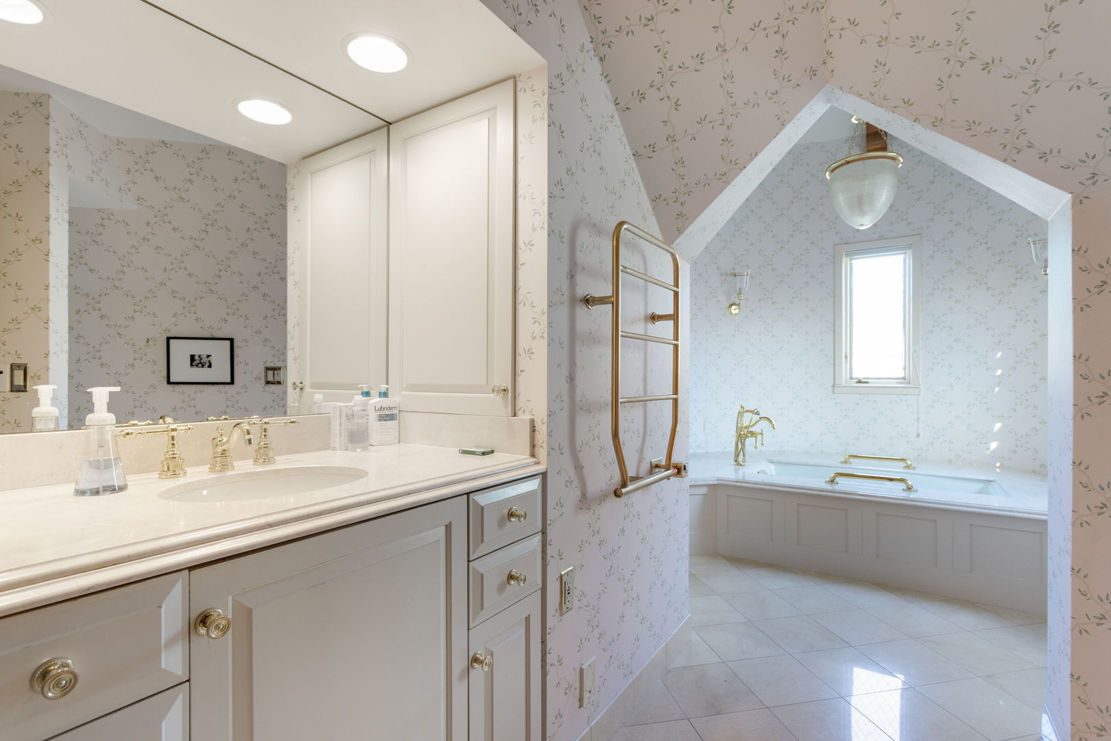 1490 Lake Road Lake Forest, IL 60045 - Photo 19 of 44 a spacious bathroom with a double vanity sink mirror and bathtub