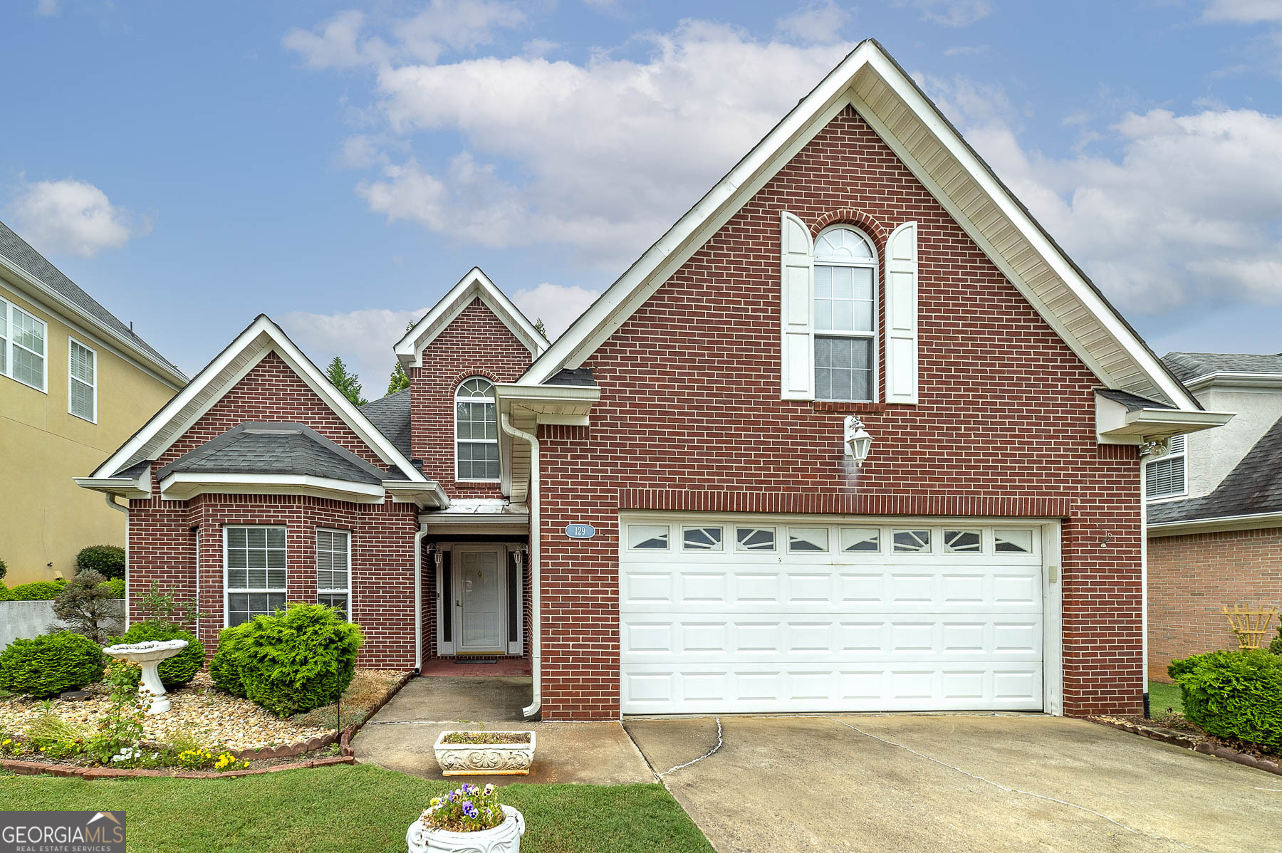 129 Wexford Court Stockbridge, GA 30281 - Photo 1 of 1 a front view of a house with a yard and garage