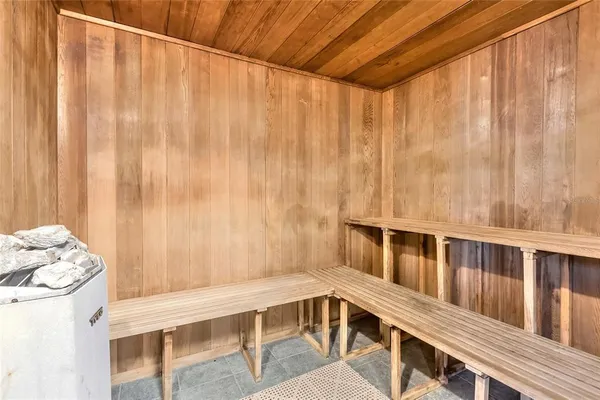 a balcony with table and chairs