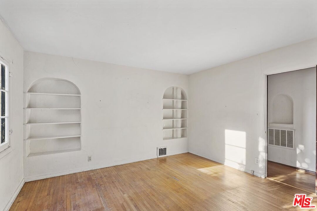 266 Mabery Road Santa Monica, CA 90402 - Photo 14 of 29 a view of empty room with wooden floor and cabinet